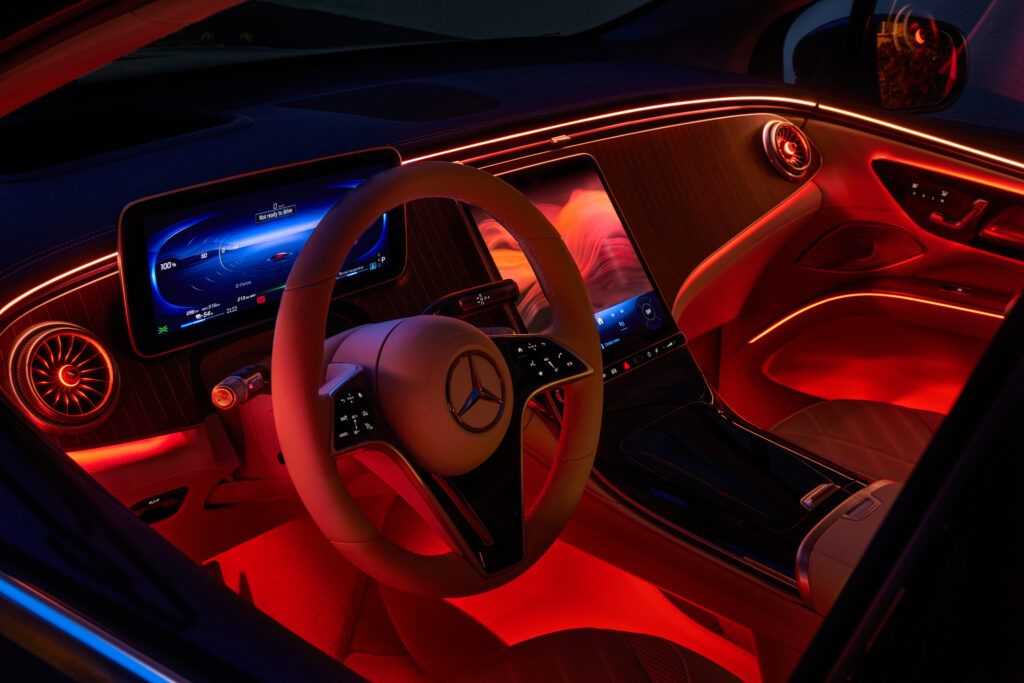 Night lighting cabin of luxury Mercedes EQS SUV finished with real wood and leather and a huge multimedia screen MBUX. Katowice,Poland - 28.05.2023